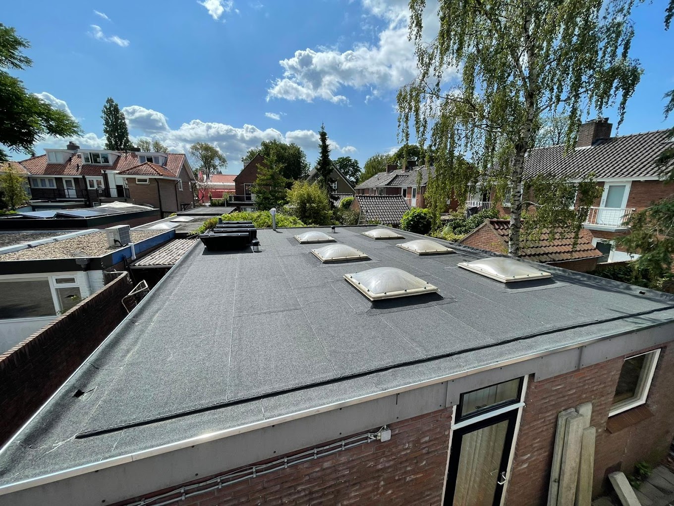 Hoe lang gaat een plat dak mee?